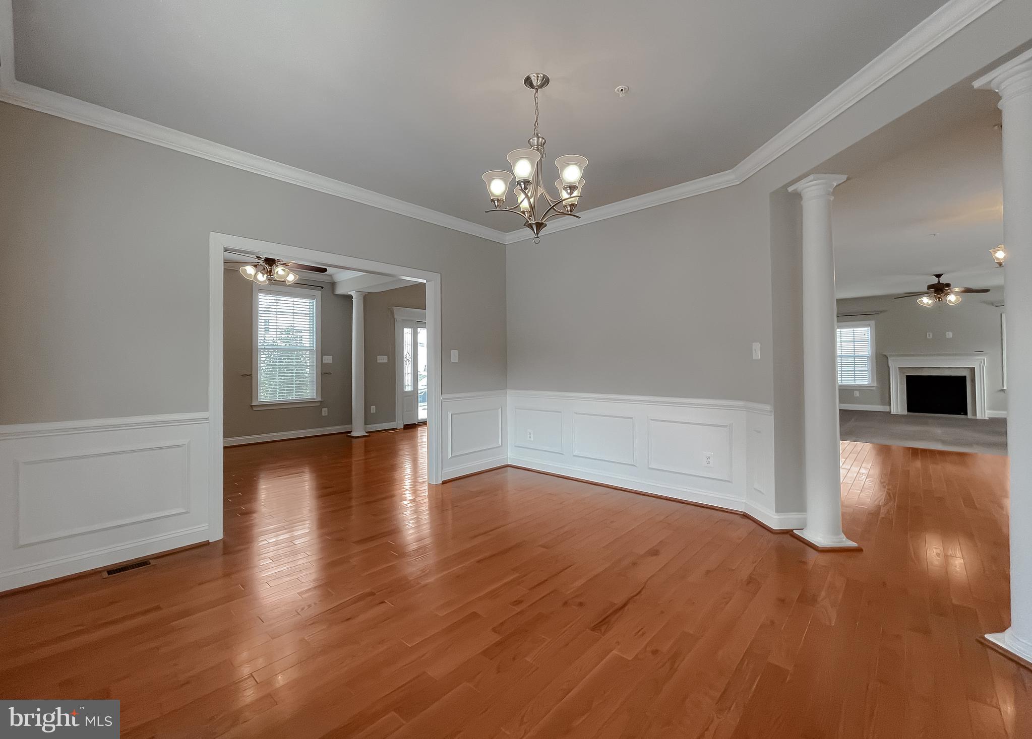 43361 Quail Street Hollywood, MD 20636 - Photo 10 of 73 a view of a livingroom with wooden floor and a ceiling fan