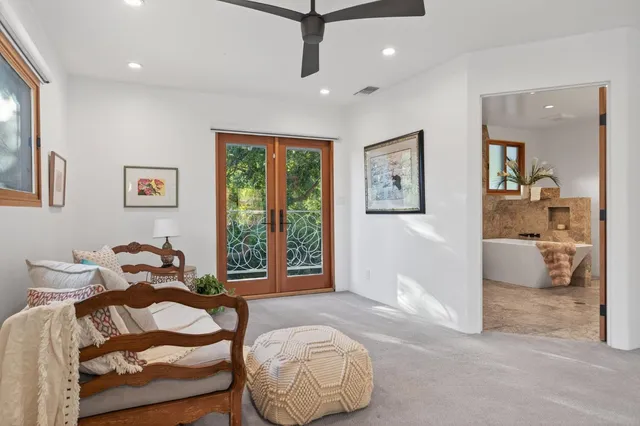 a bedroom with furniture and a window