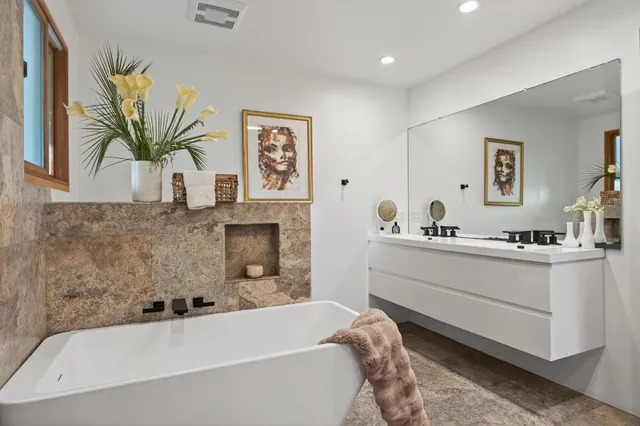 a bathroom with a bathtub and a sink