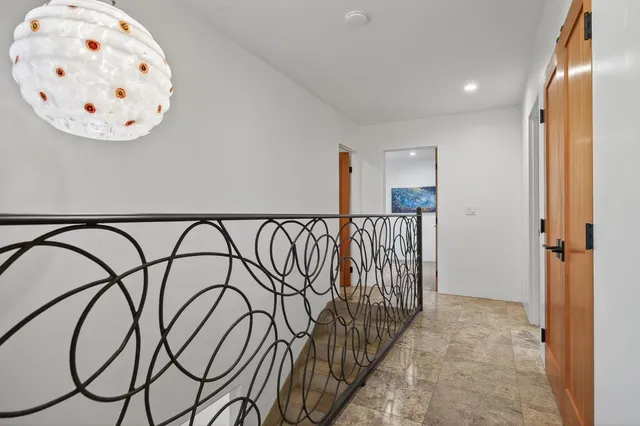 a view of an entryway with wooden floor