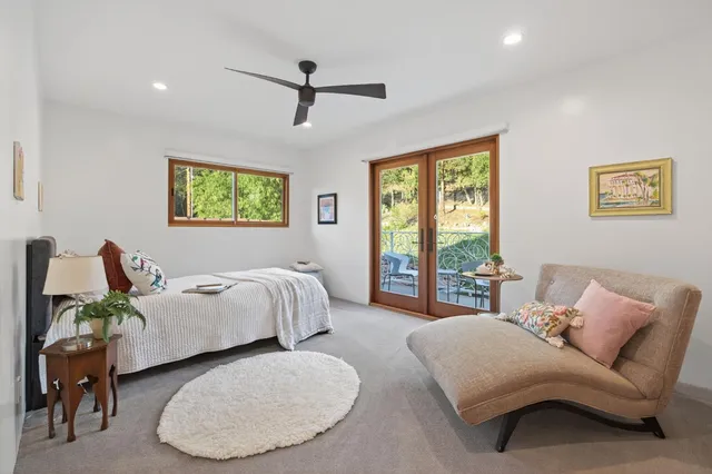 a bedroom with a bed and a couch