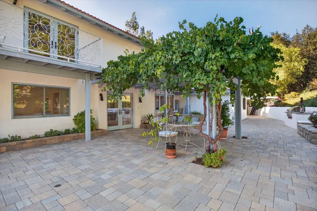 a view of a patio with swimming pool