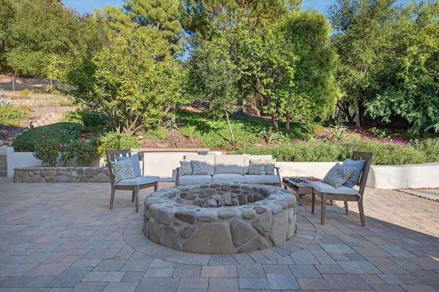 a view of a swimming pool with a lounge chairs