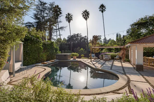 a view of swimming pool with outdoor seating