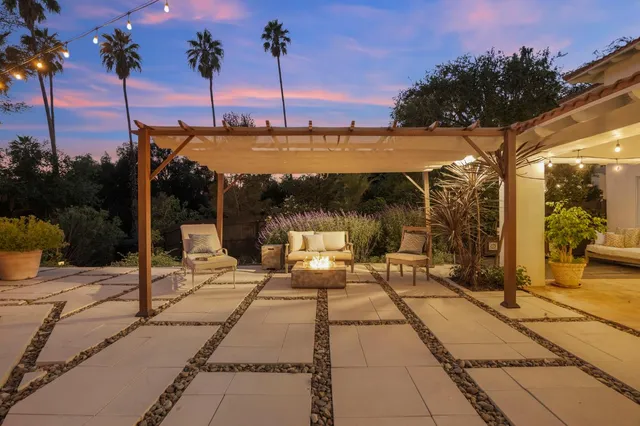 a view of a swimming pool with a patio