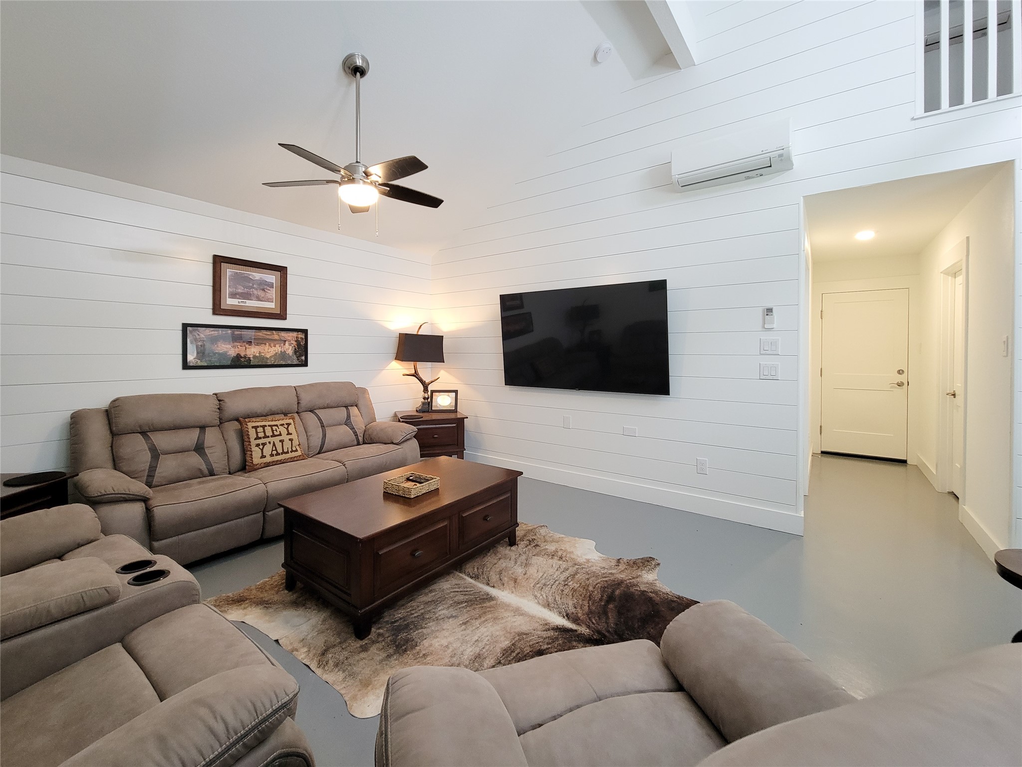 4937 Wolff Road Round Top, TX 78954 - Photo 10 of 31 Sleek, low-maintenance stained concrete flooring adds modern elegance.