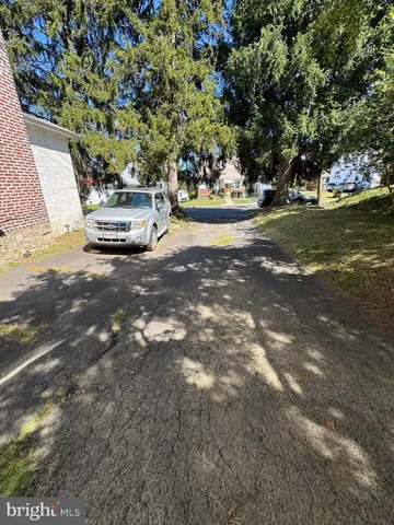 a view of street with parked cars