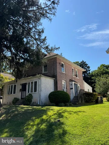 a house view with a garden space