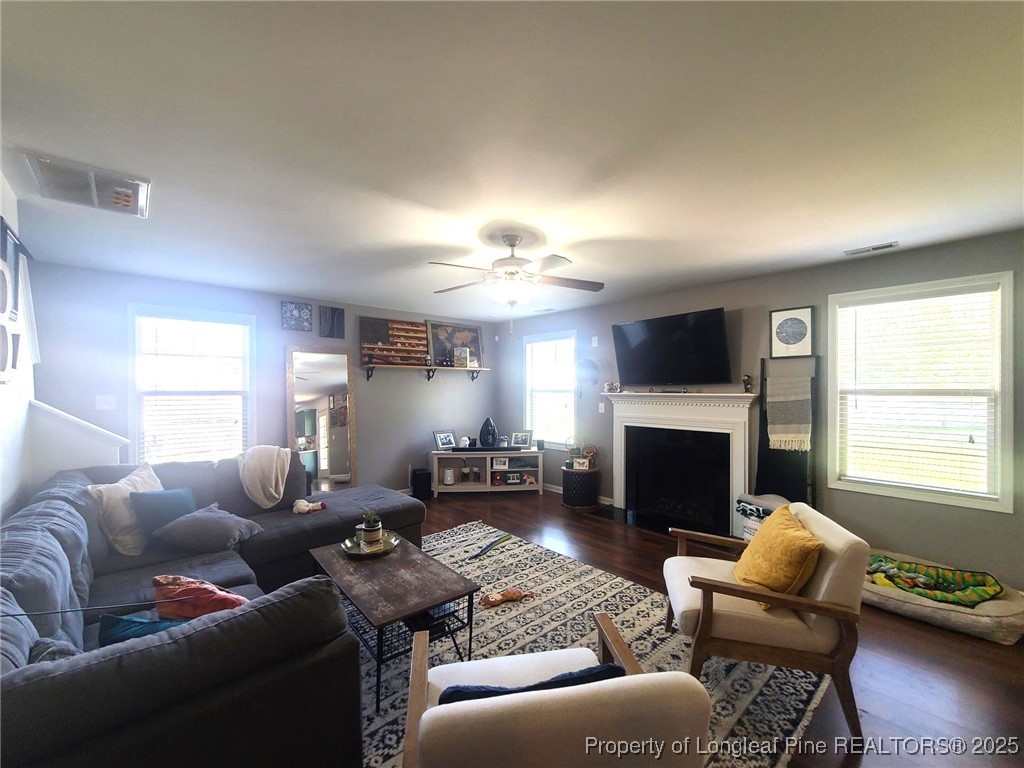 139 Spillburg Court Raeford, NC 28376 - Photo 11 of 33 a living room with furniture a fireplace and a window