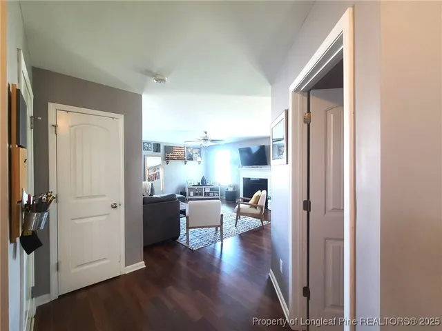 a view of entryway with livingroom and wooden floor