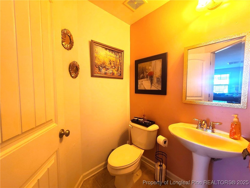 139 Spillburg Court Raeford, NC 28376 - Photo 14 of 33 a bathroom with a sink and a toilet