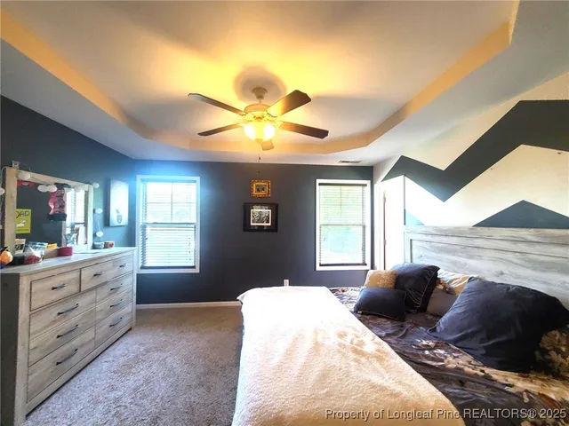 a bed room with a bed and a window