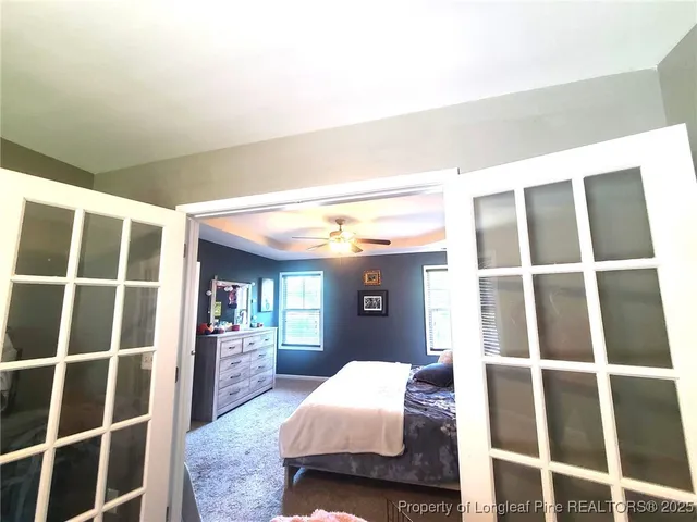 a bedroom with a bed and walk in closet