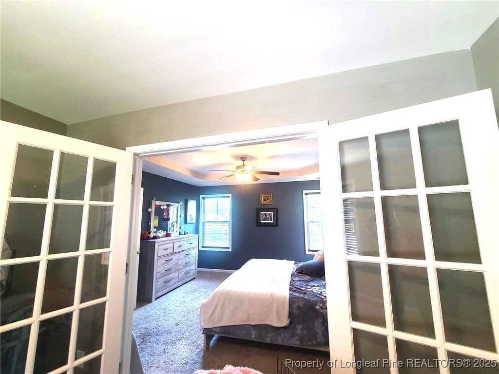 139 Spillburg Court Raeford, NC 28376 - Photo 22 of 33 a bedroom with a bed and walk in closet