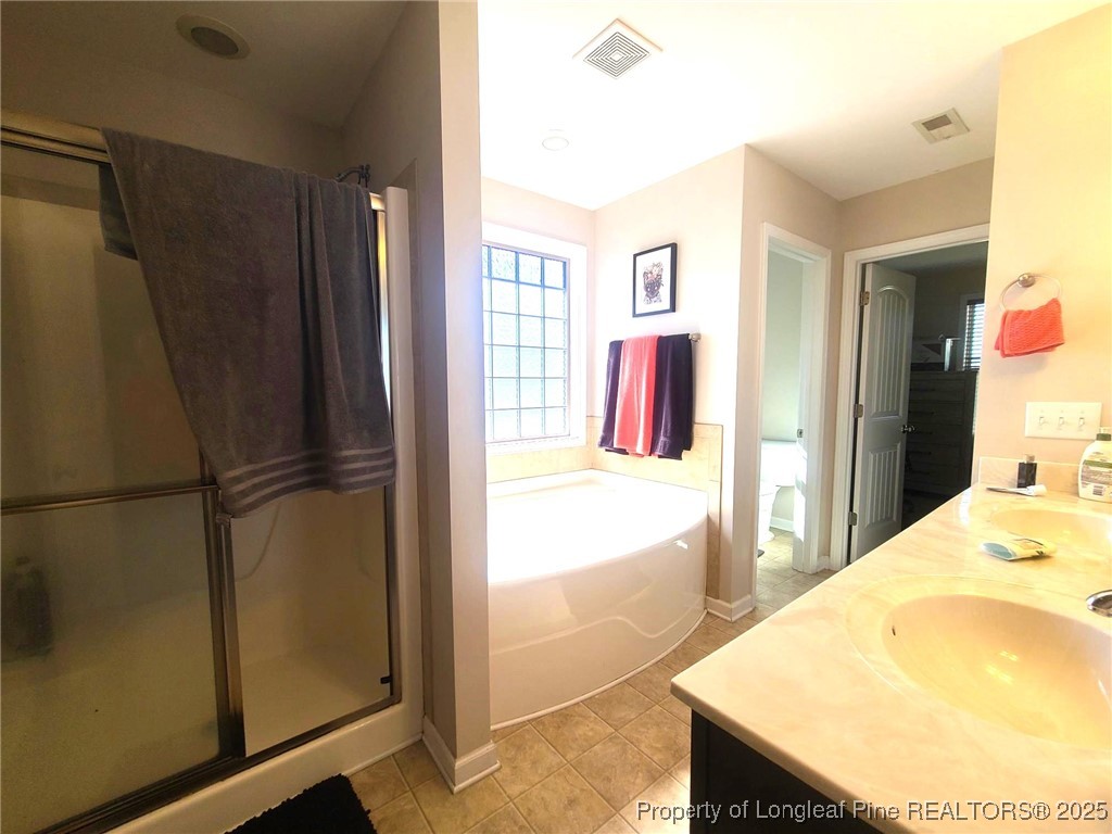 139 Spillburg Court Raeford, NC 28376 - Photo 29 of 33 a bathroom with a tub and a sink