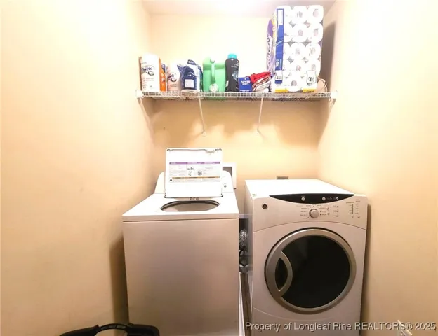 a view of washer and dryer with kitchen countertop