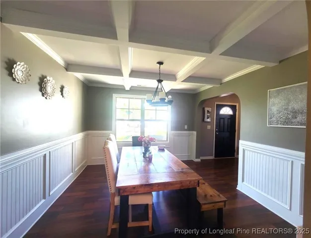 a view of a dining room with furniture