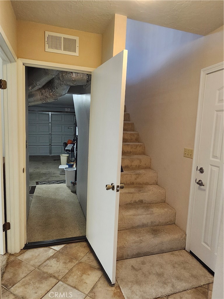 240 Melrose Drive Oxnard, CA 93035 - Photo 47 of 55 Door to Garage with Washer/Dryer. Front door and stairs to main living area