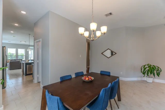 a kitchen with a stove sink and cabinets