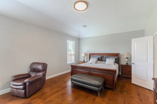 a spacious bathroom with a double vanity sink a mirror and a shower
