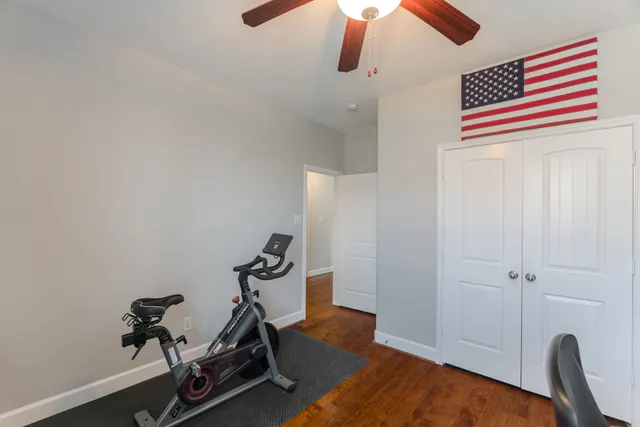 a bedroom with a bed and flat screen tv