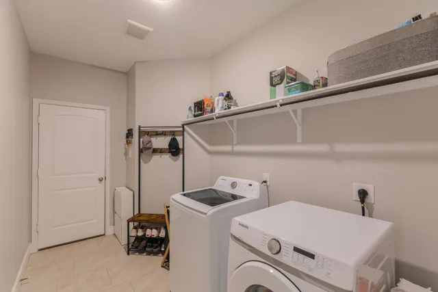 a bedroom with a bed and a ceiling fan