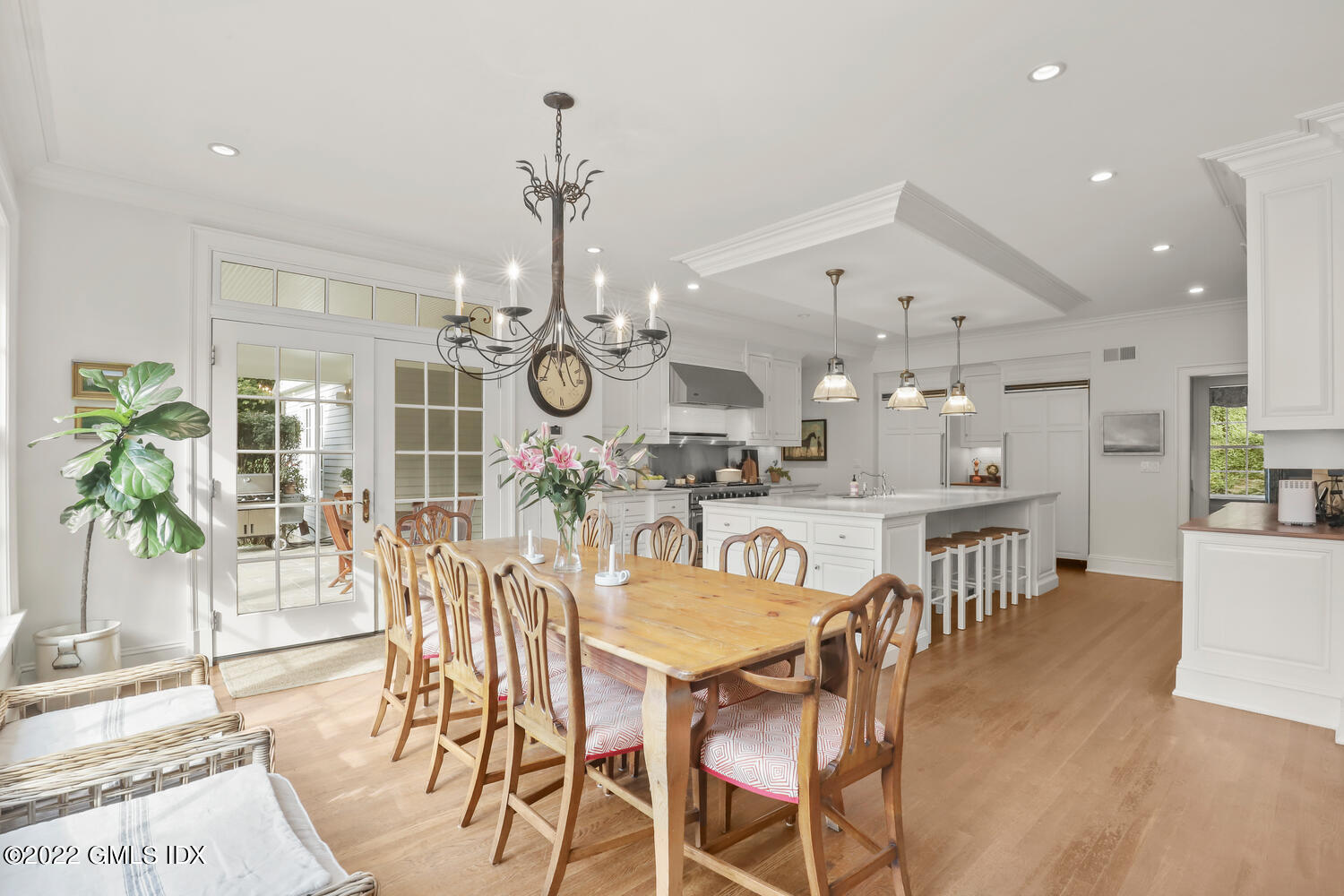 33 Hill Road Greenwich, CT 06830 - Photo 11 of 49 a view of a dining room and livingroom with furniture wooden floor a chandelier