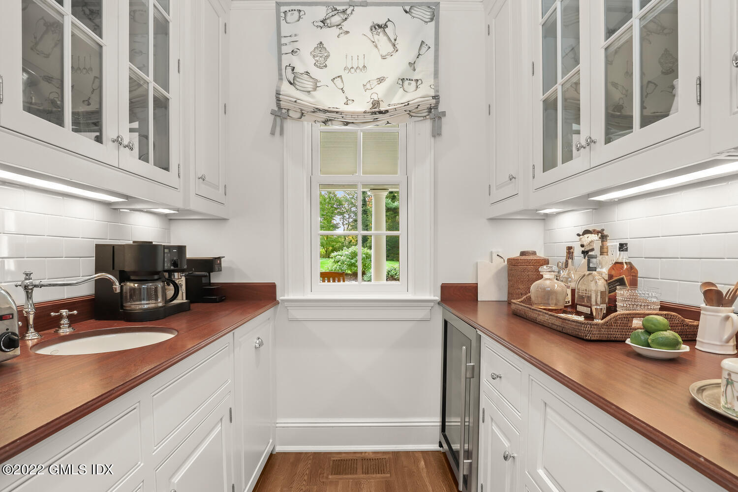 33 Hill Road Greenwich, CT 06830 - Photo 15 of 49 a kitchen with stainless steel appliances a sink a window and cabinets
