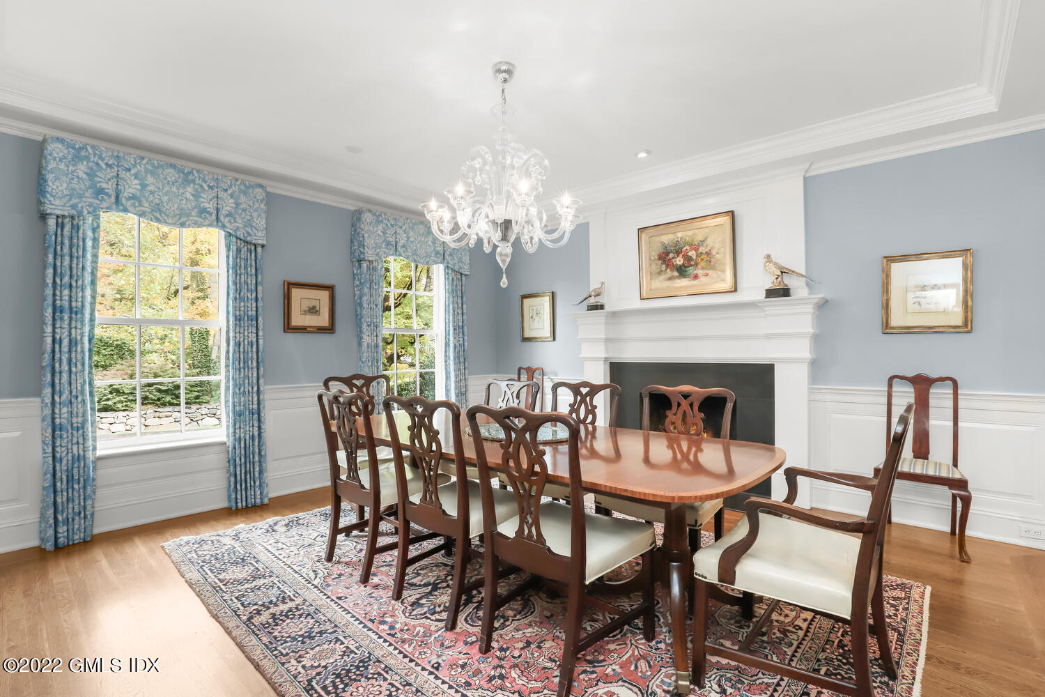 33 Hill Road Greenwich, CT 06830 - Photo 17 of 49 a view of a dining room with furniture a chandelier and wooden floor