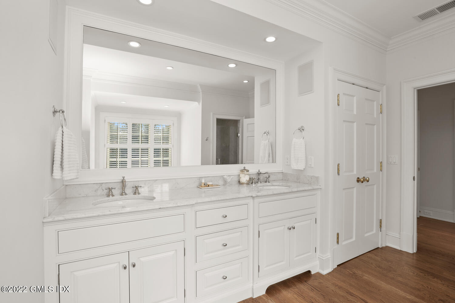 33 Hill Road Greenwich, CT 06830 - Photo 22 of 49 a bathroom with double sink and a mirror