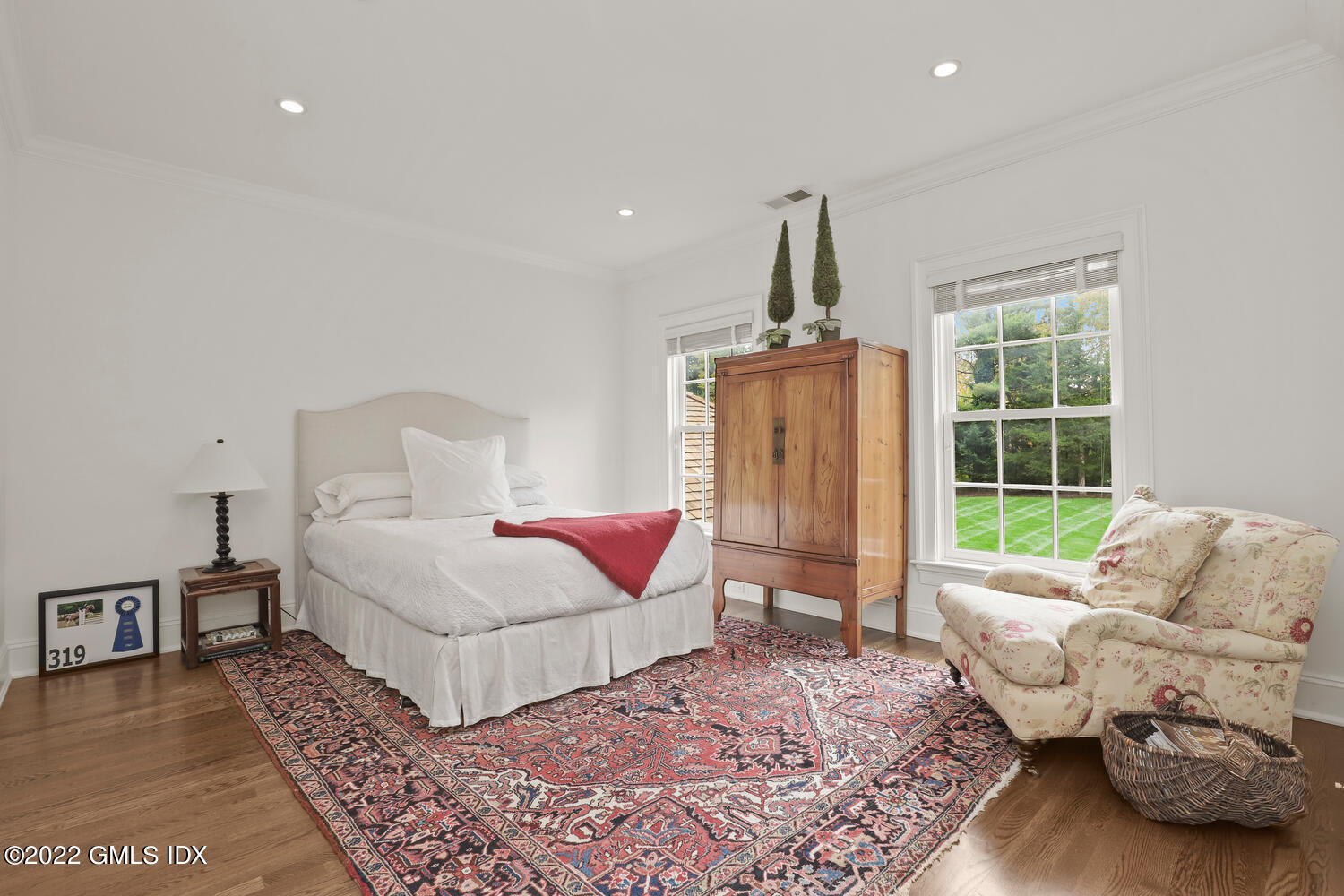 33 Hill Road Greenwich, CT 06830 - Photo 24 of 49 a bedroom with a bed and a window