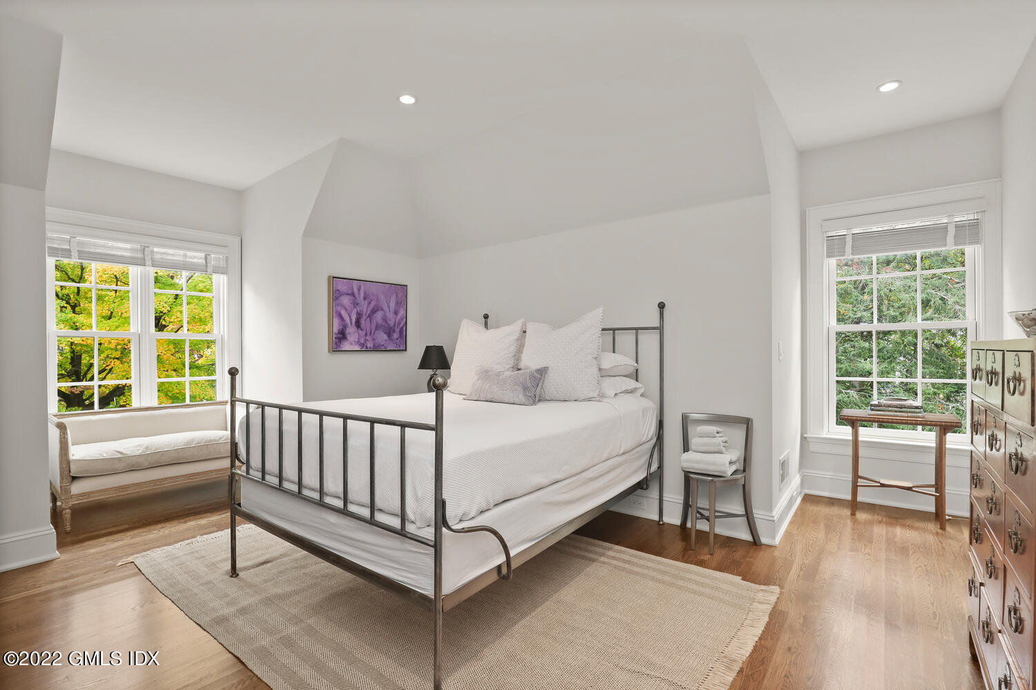 33 Hill Road Greenwich, CT 06830 - Photo 28 of 49 a bed room with a bed and a chair