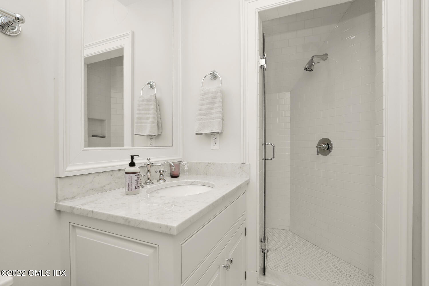 33 Hill Road Greenwich, CT 06830 - Photo 29 of 49 a bathroom with a sink and a mirror