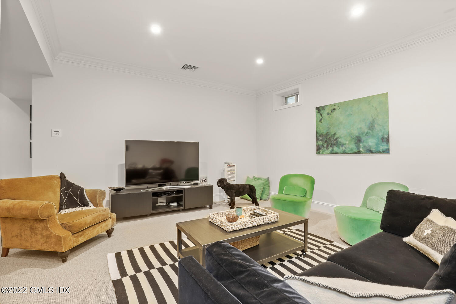 33 Hill Road Greenwich, CT 06830 - Photo 33 of 49 a living room with furniture and a flat screen tv