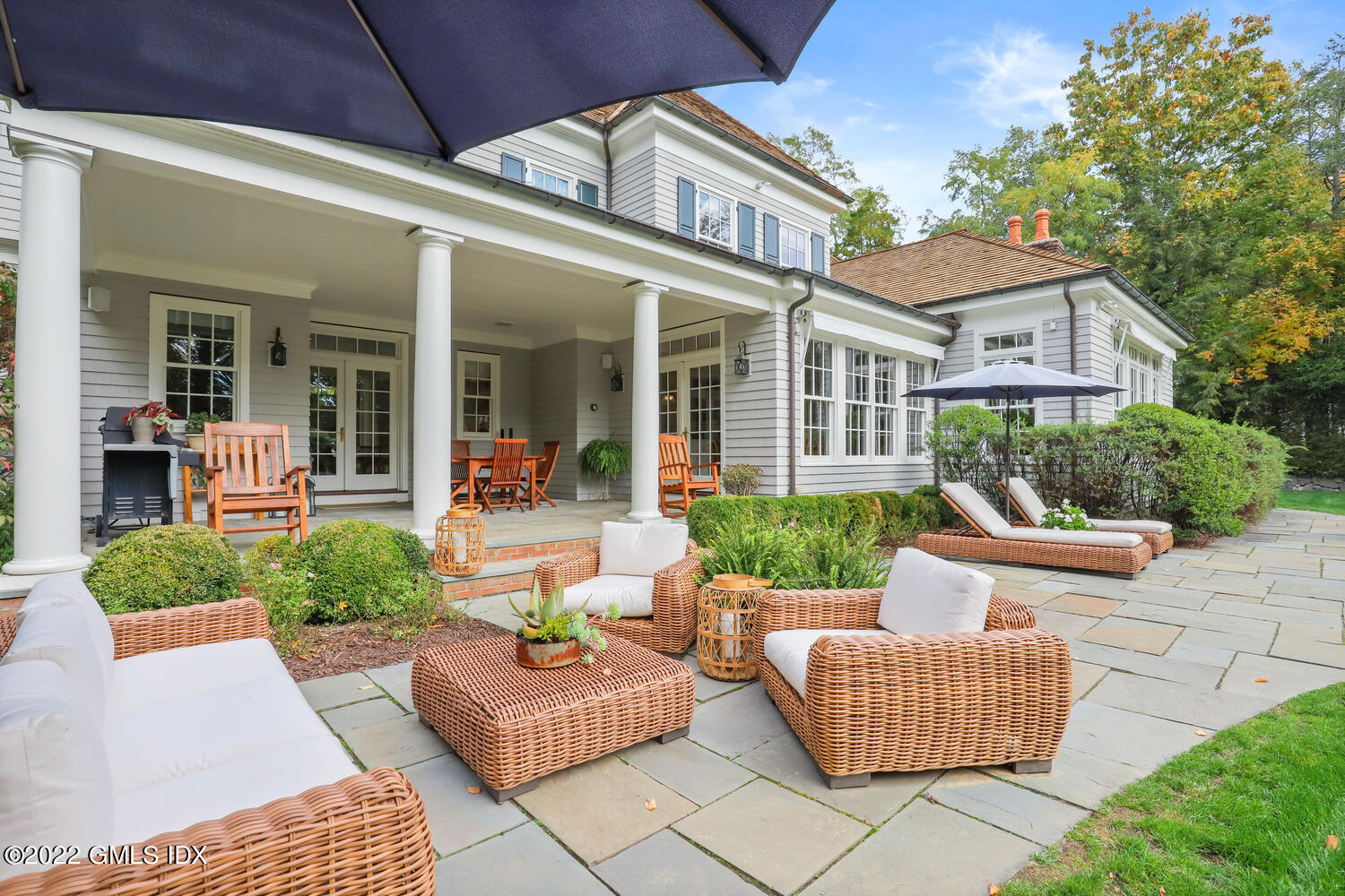 33 Hill Road Greenwich, CT 06830 - Photo 40 of 49 front view of a house with patio