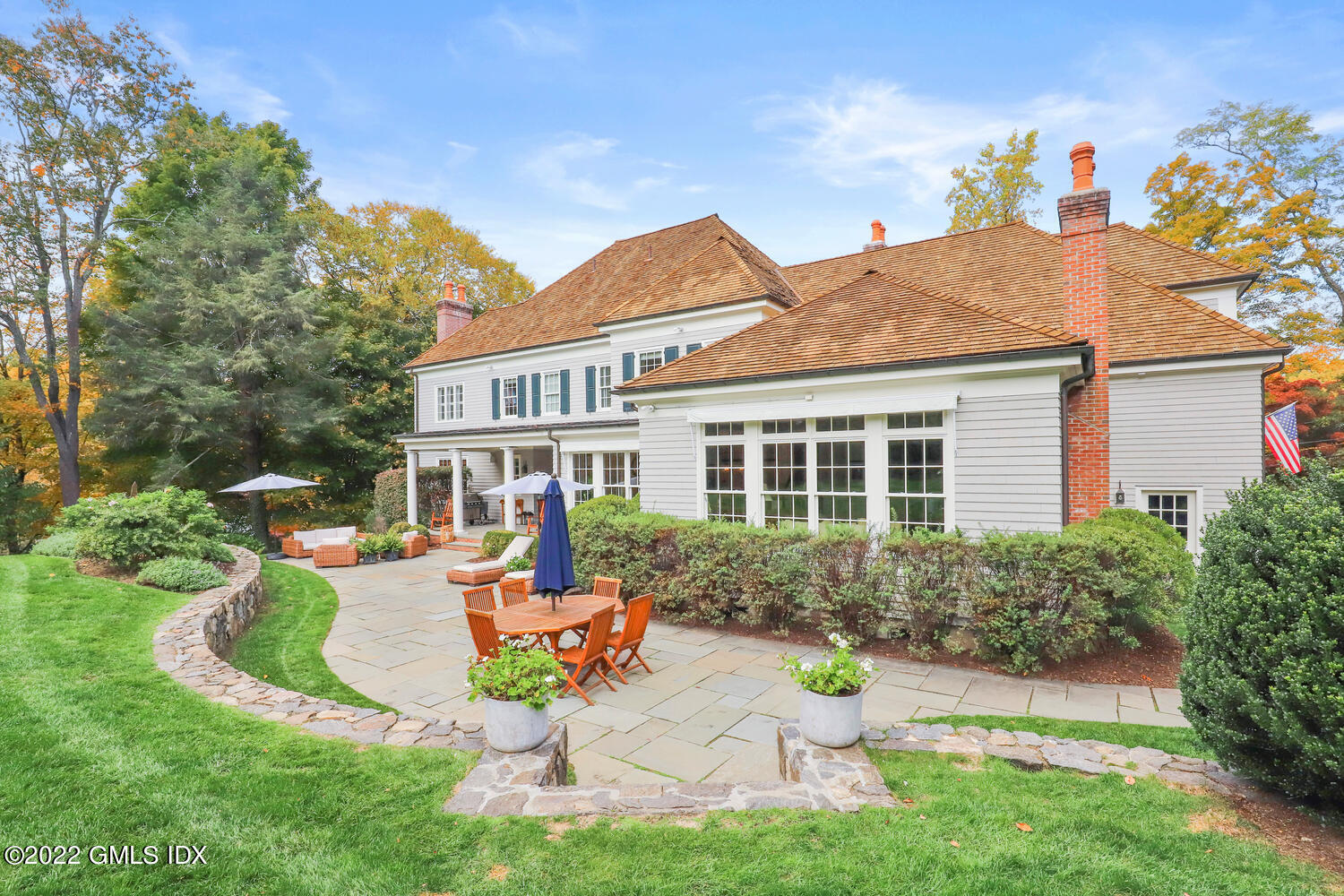 33 Hill Road Greenwich, CT 06830 - Photo 41 of 49 a view of a house with backyard sitting area and garden