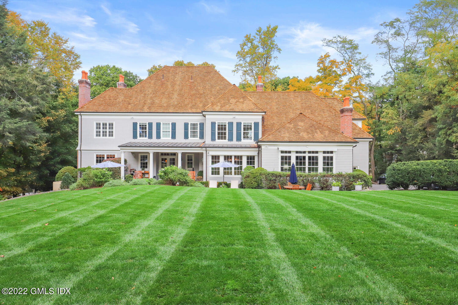33 Hill Road Greenwich, CT 06830 - Photo 42 of 49 a front view of a house with a garden