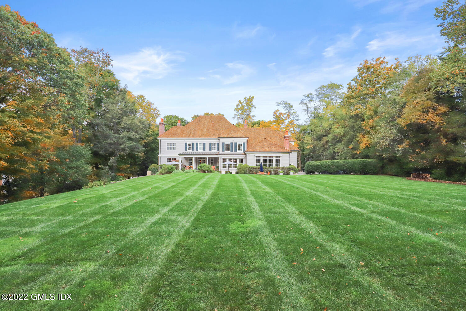 33 Hill Road Greenwich, CT 06830 - Photo 43 of 49 a view of a big yard next to a building