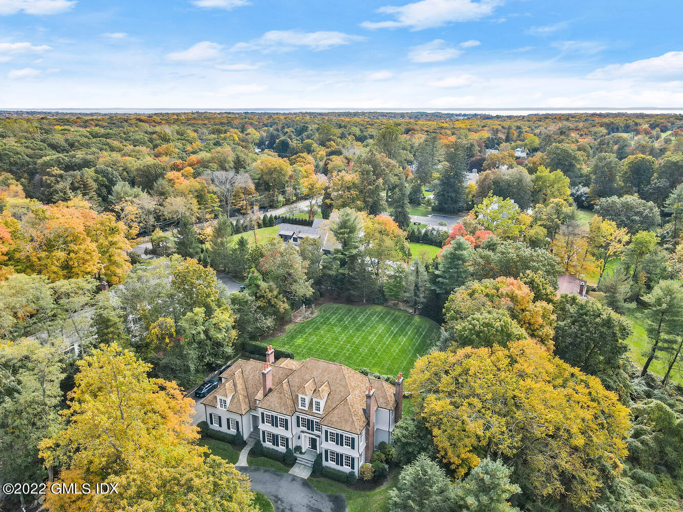 33 Hill Road Greenwich, CT 06830 - Photo 44 of 49 an aerial view of a house with a yard