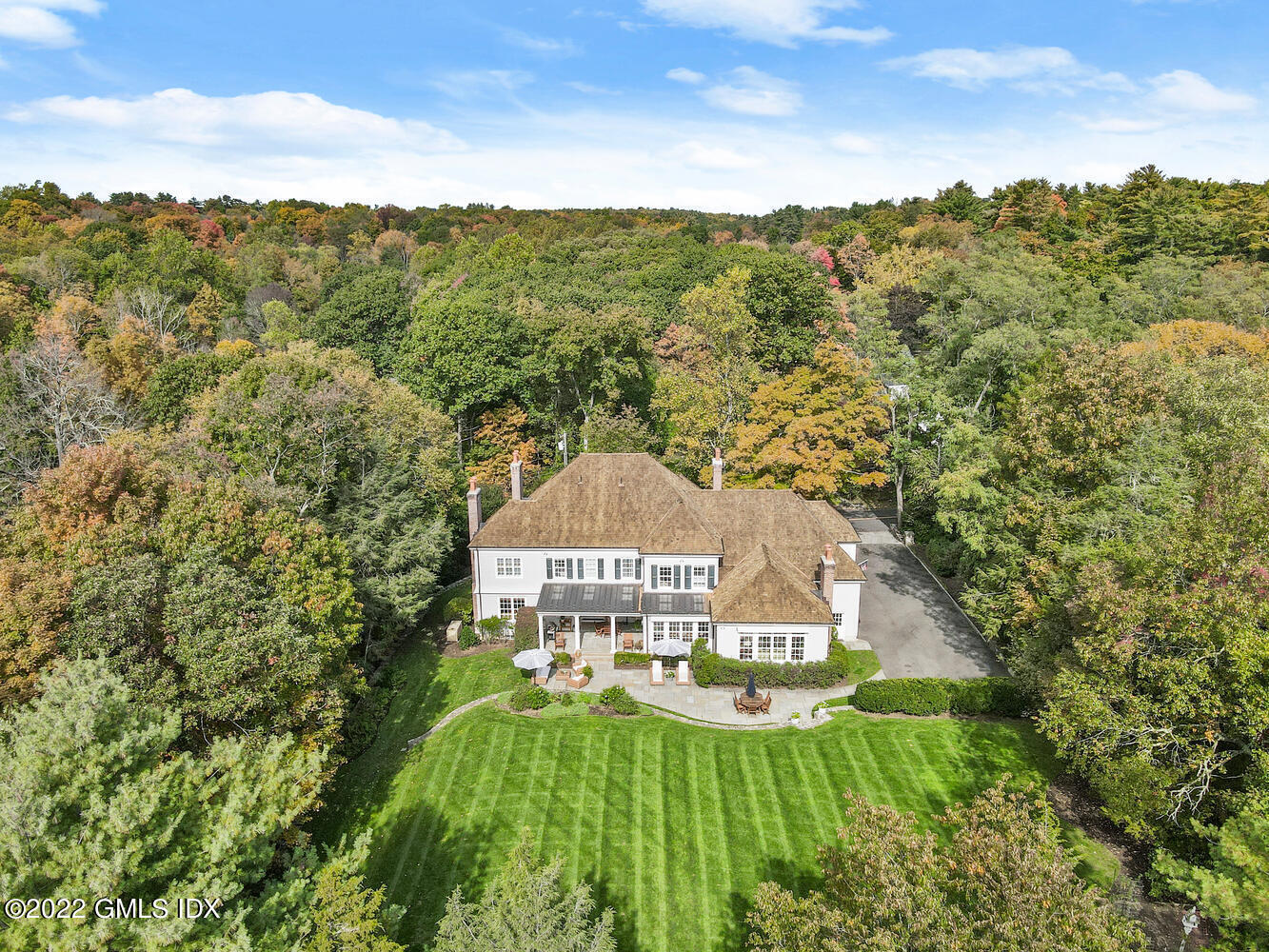 33 Hill Road Greenwich, CT 06830 - Photo 45 of 49 a view of a city with lush green forest