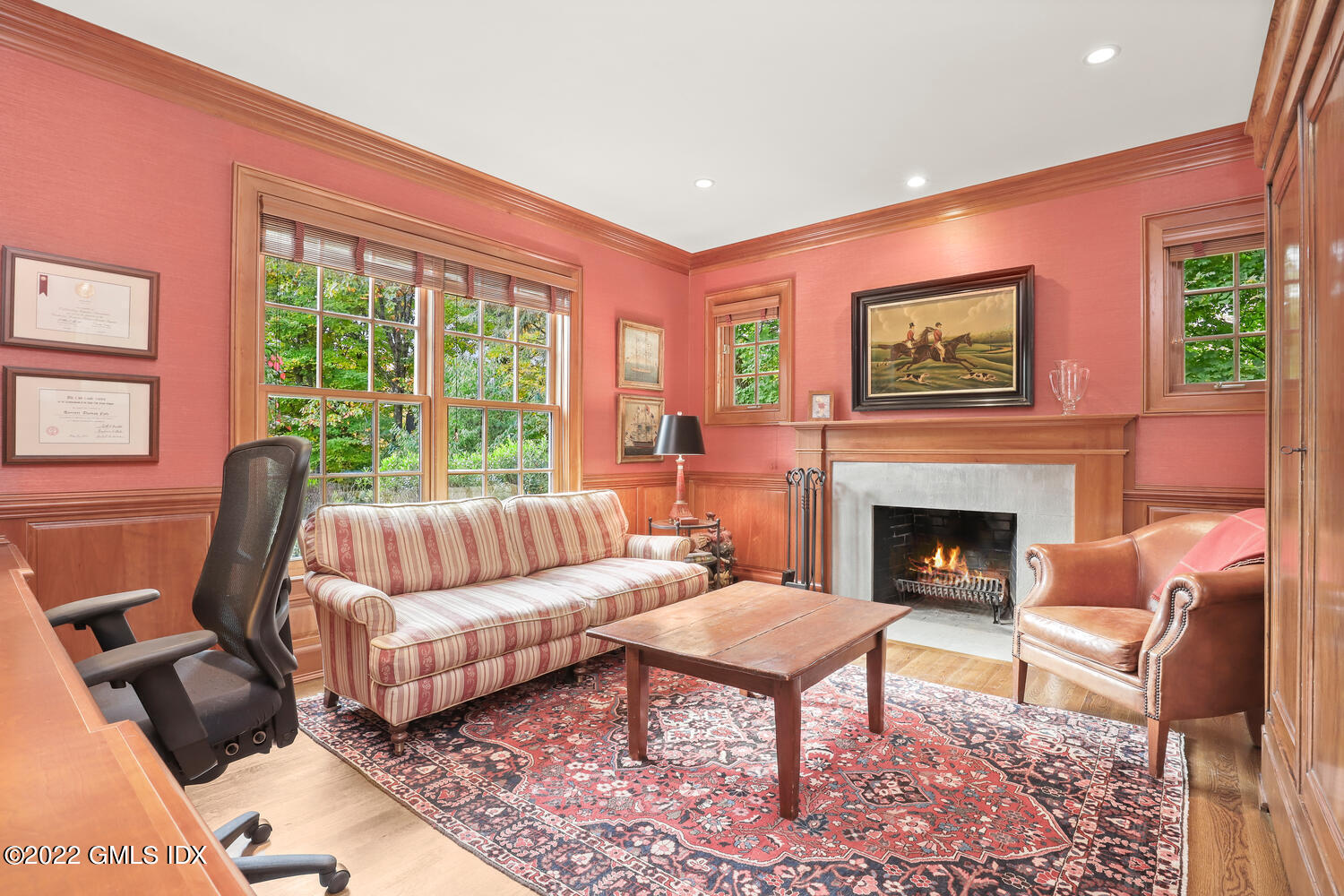 33 Hill Road Greenwich, CT 06830 - Photo 7 of 49 a living room with furniture fireplace and a large window
