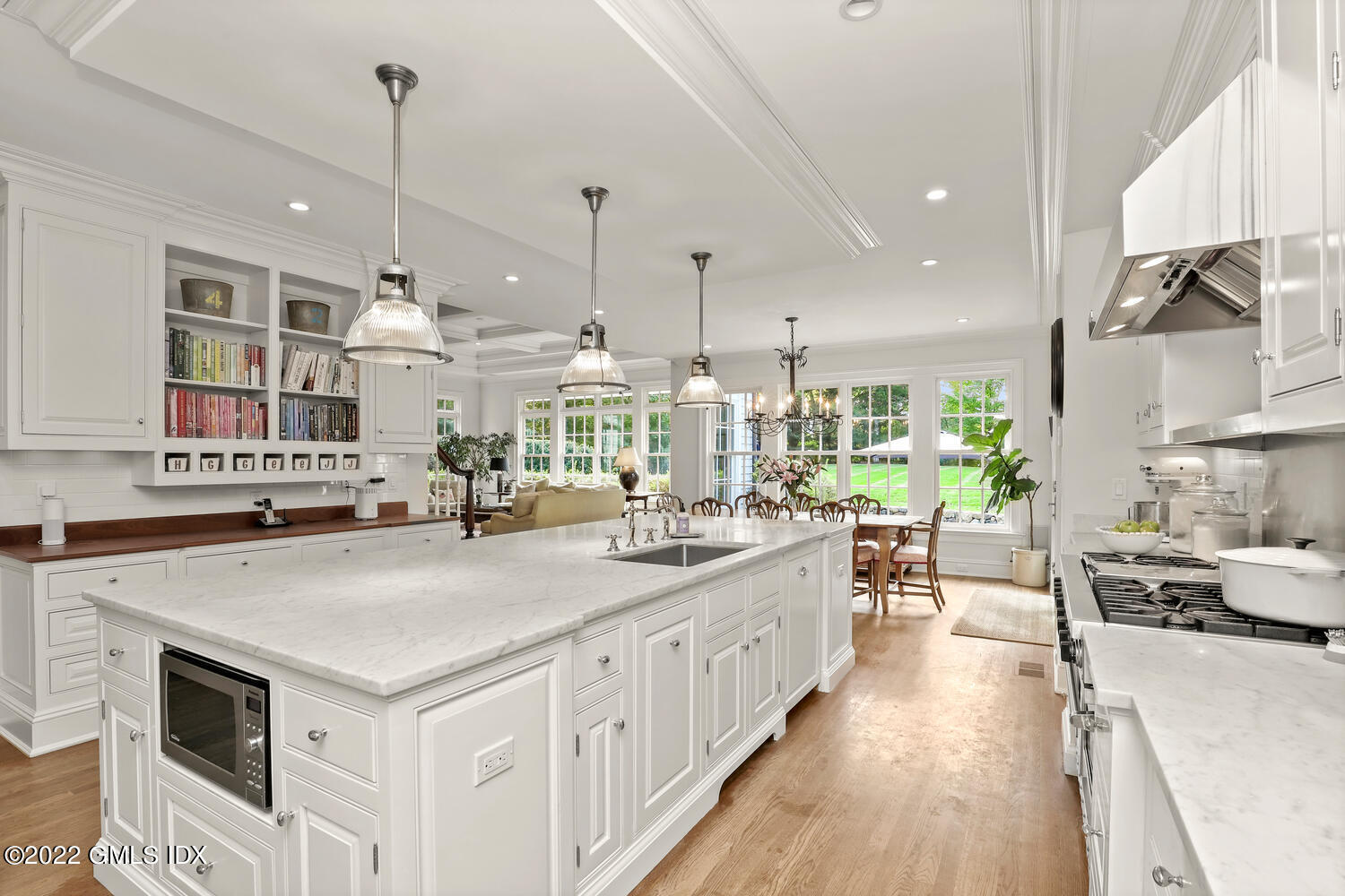 33 Hill Road Greenwich, CT 06830 - Photo 8 of 49 a kitchen with stainless steel appliances a stove a sink a oven a dining table and chairs