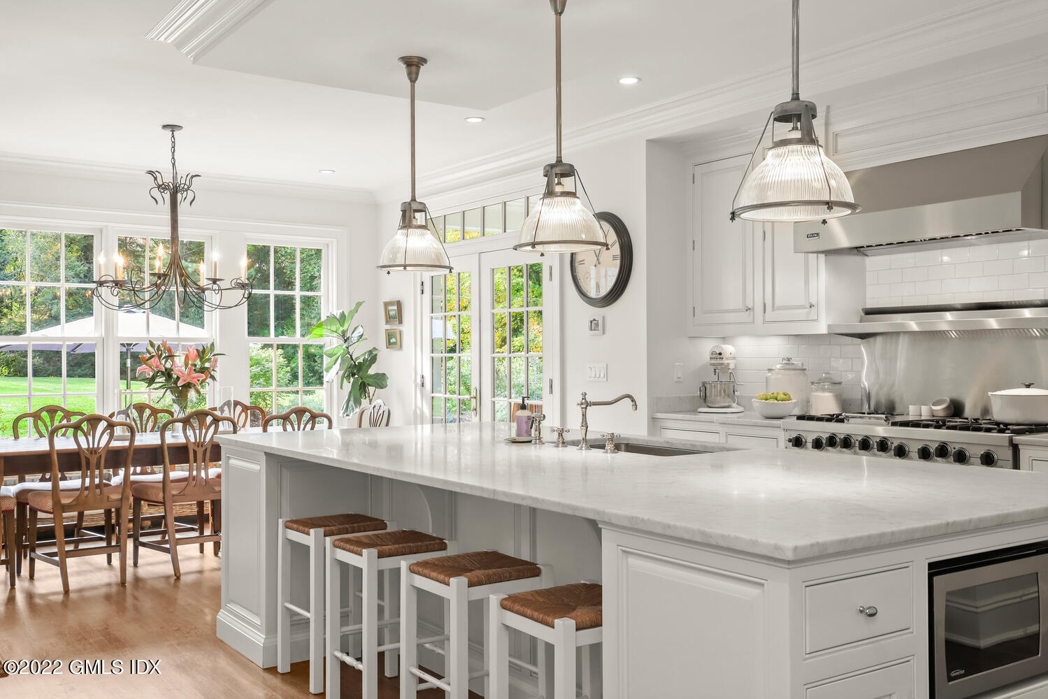 33 Hill Road Greenwich, CT 06830 - Photo 9 of 49 a kitchen with a sink a stove and a wooden floors