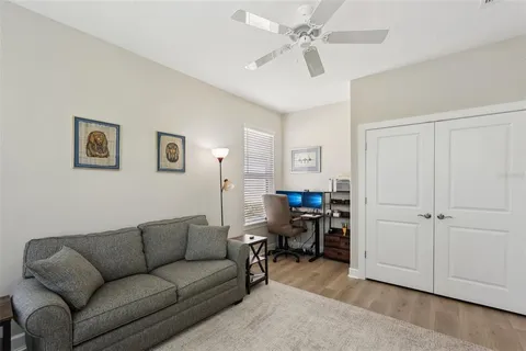 a bedroom with a bed and a mirror