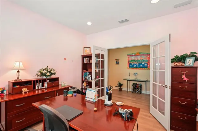 a view of walk in closet with clothes