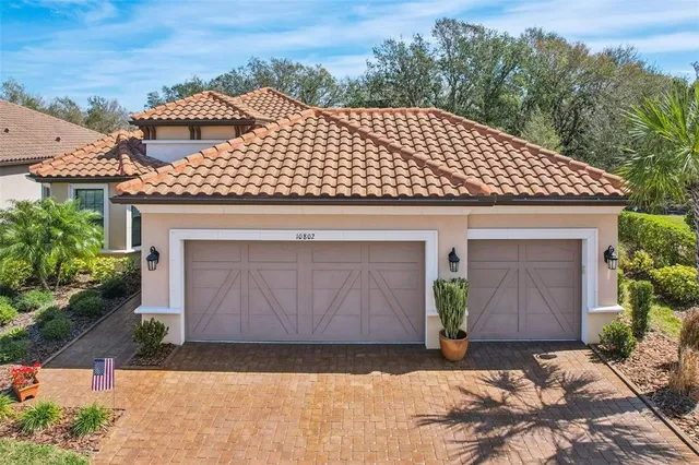 an aerial view of a house with a swimming pool