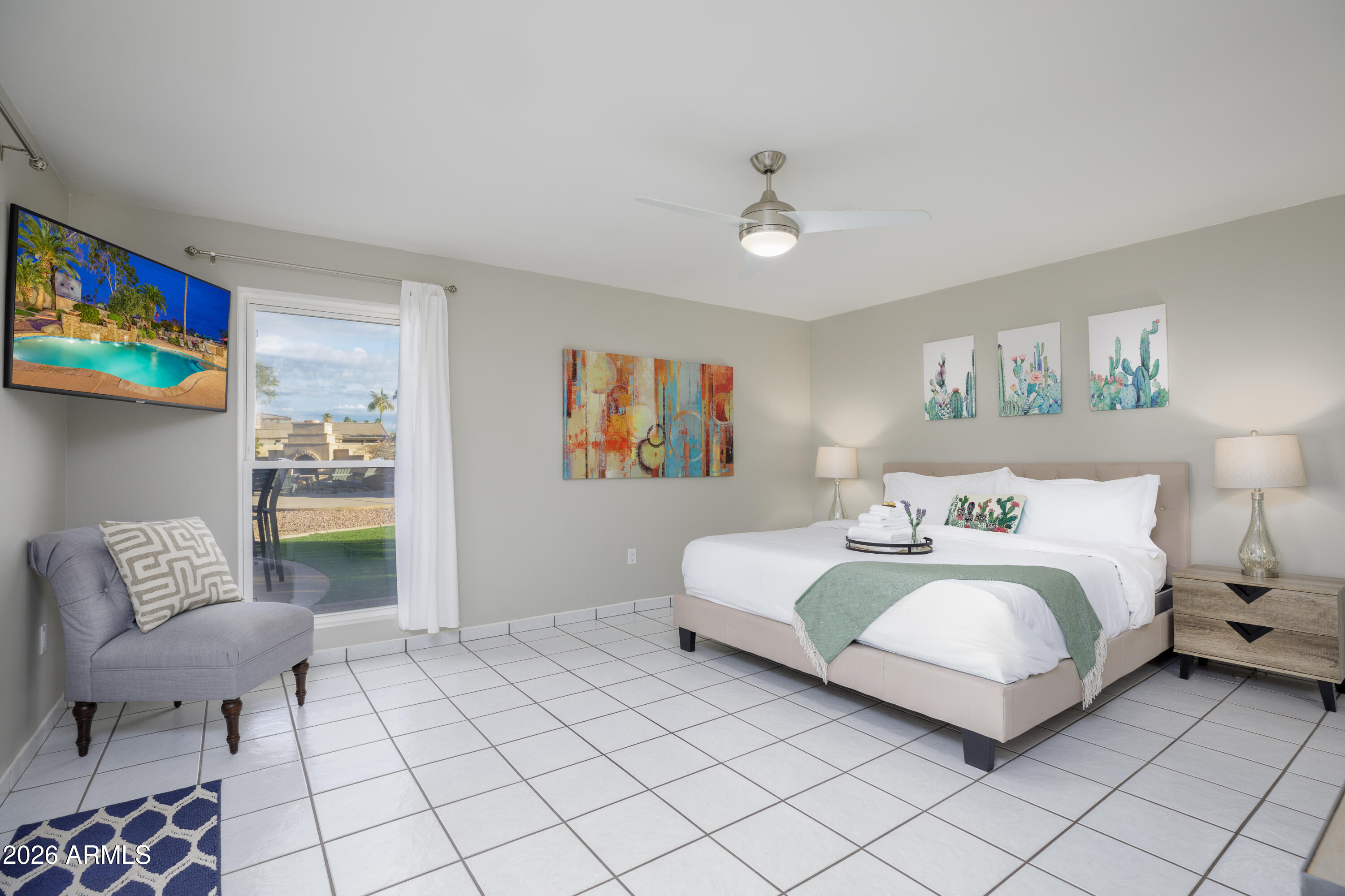 6932 East Presidio Road Scottsdale, AZ 85254 - Photo 21 of 30 a bedroom with a bed and a couch