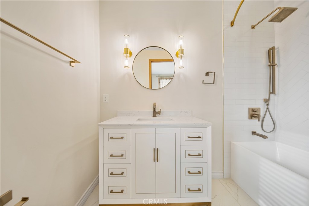 216 North Buena Vista Street Burbank, CA 91505 - Photo 13 of 22 a bathroom with a shower a sink and a mirror
