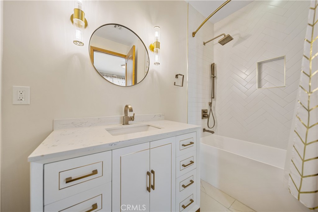 216 North Buena Vista Street Burbank, CA 91505 - Photo 14 of 22 a bathroom with a sink a vanity a mirror and a shower