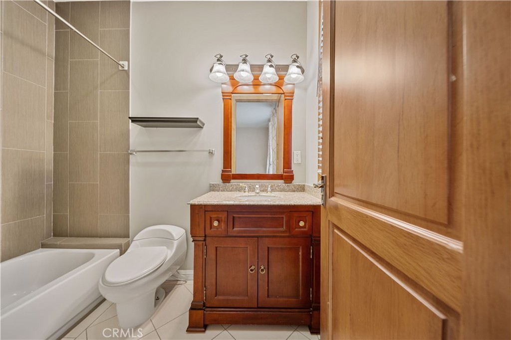 216 North Buena Vista Street Burbank, CA 91505 - Photo 20 of 22 a bathroom with a toilet a sink and bathtub